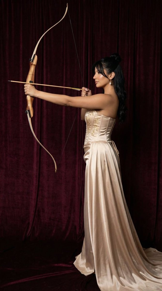 AI Prompt for Ultra-Realistic Fashion Portrait with Archer Pose and Burgundy Backdrop