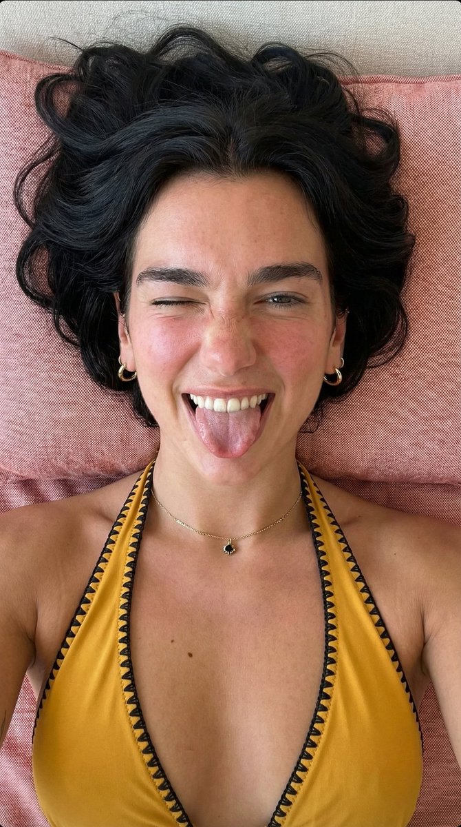 AI Prompt for Overhead Portrait of Playful Young Woman with Winking and Tongue Out Expression