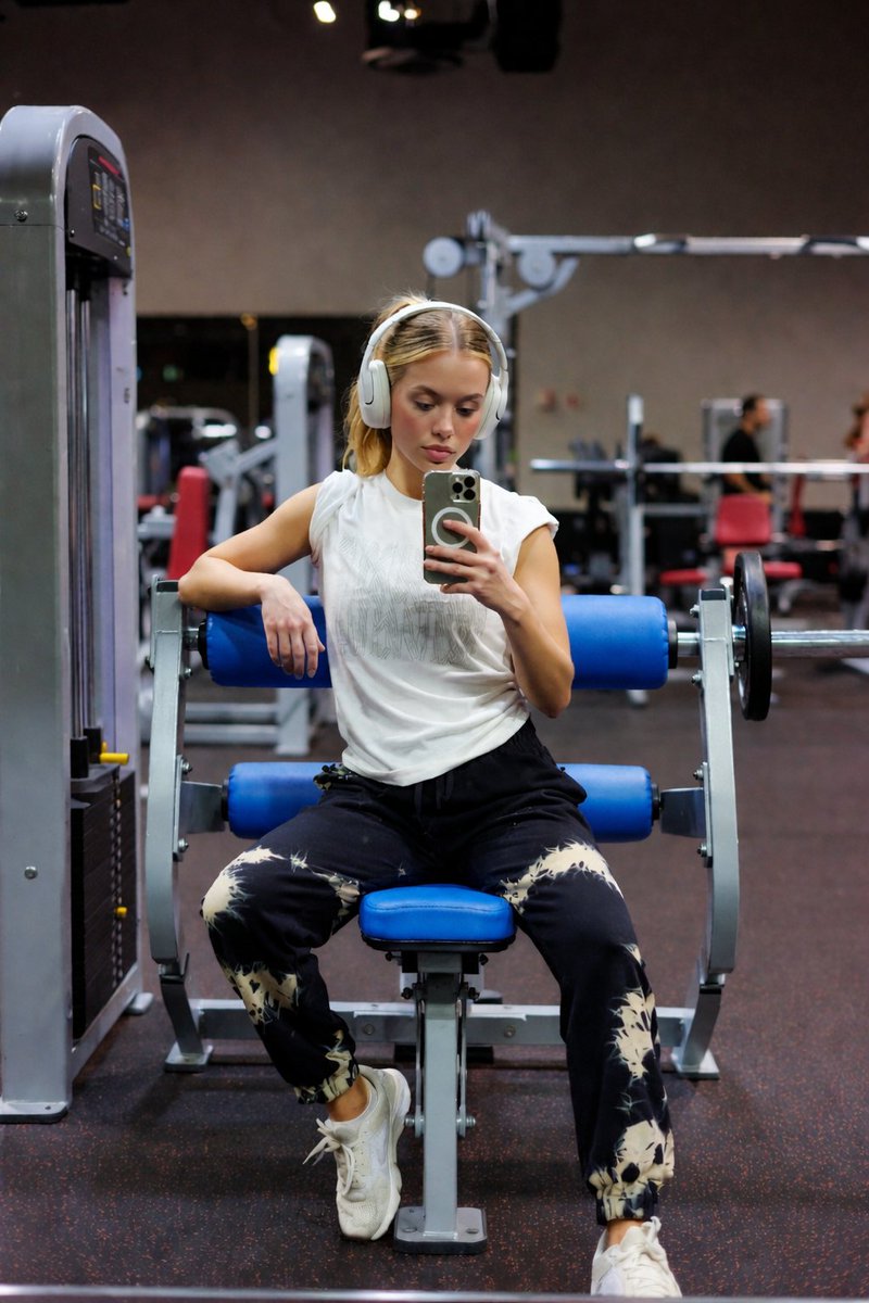 AI Prompt for Fitness Photography - Young Woman on Blue Gym Seat