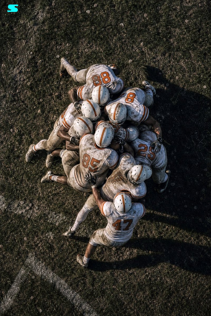 AI Prompt for High-Detail Sports Photography: Football Team Huddle on Gritty Field