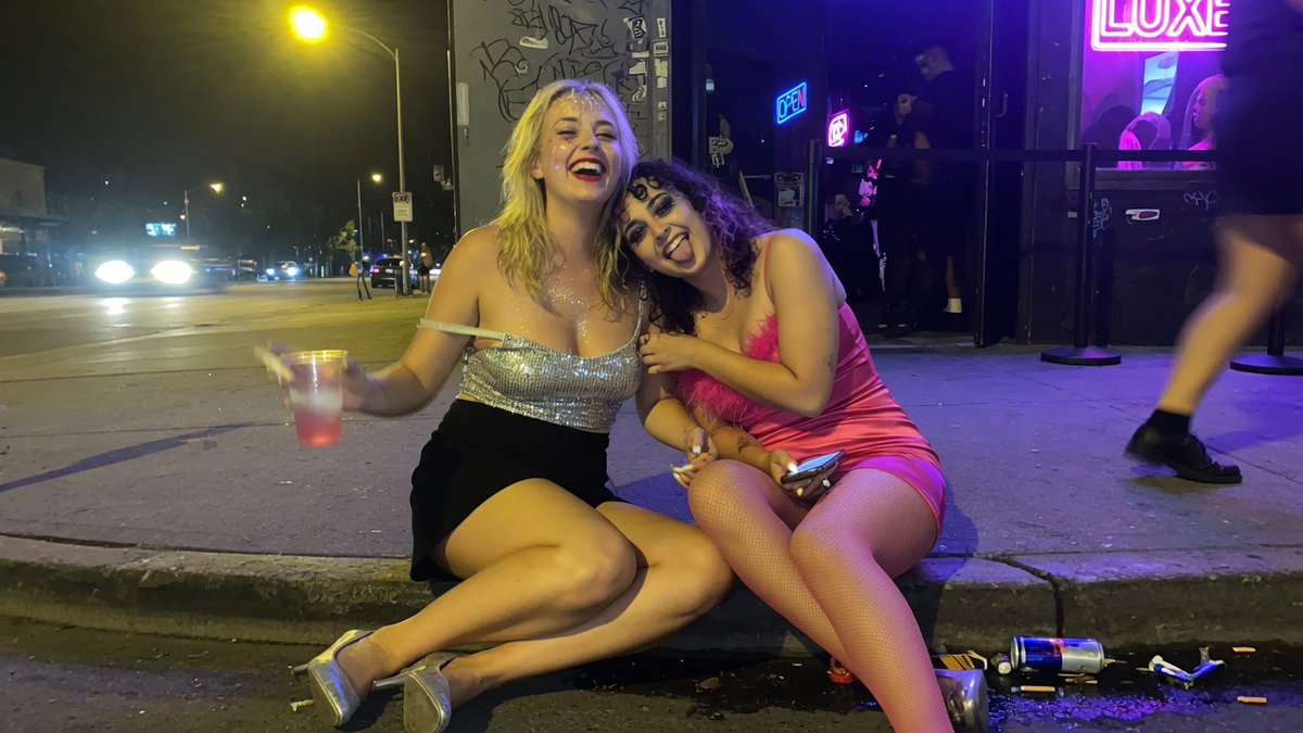 AI Prompt for Photorealistic Late-Night City Scene with Anonymized Women Outside Neon Nightclub