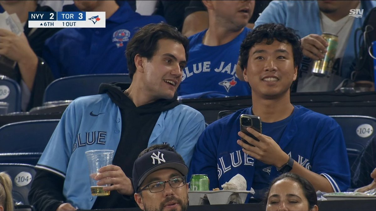 AI Prompt for Realistic Blue Jays Baseball Crowd Shot
