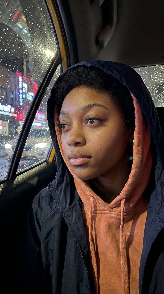 AI Prompt for Realistic iPhone Photo of Pensive Taxi Passenger on Rainy Night