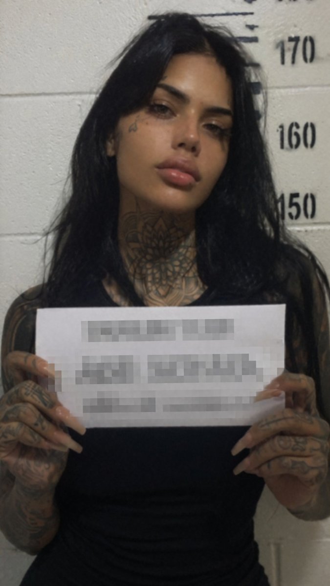 AI Prompt for Realistic Tattooed Female Mugshot with Gritty Vibes