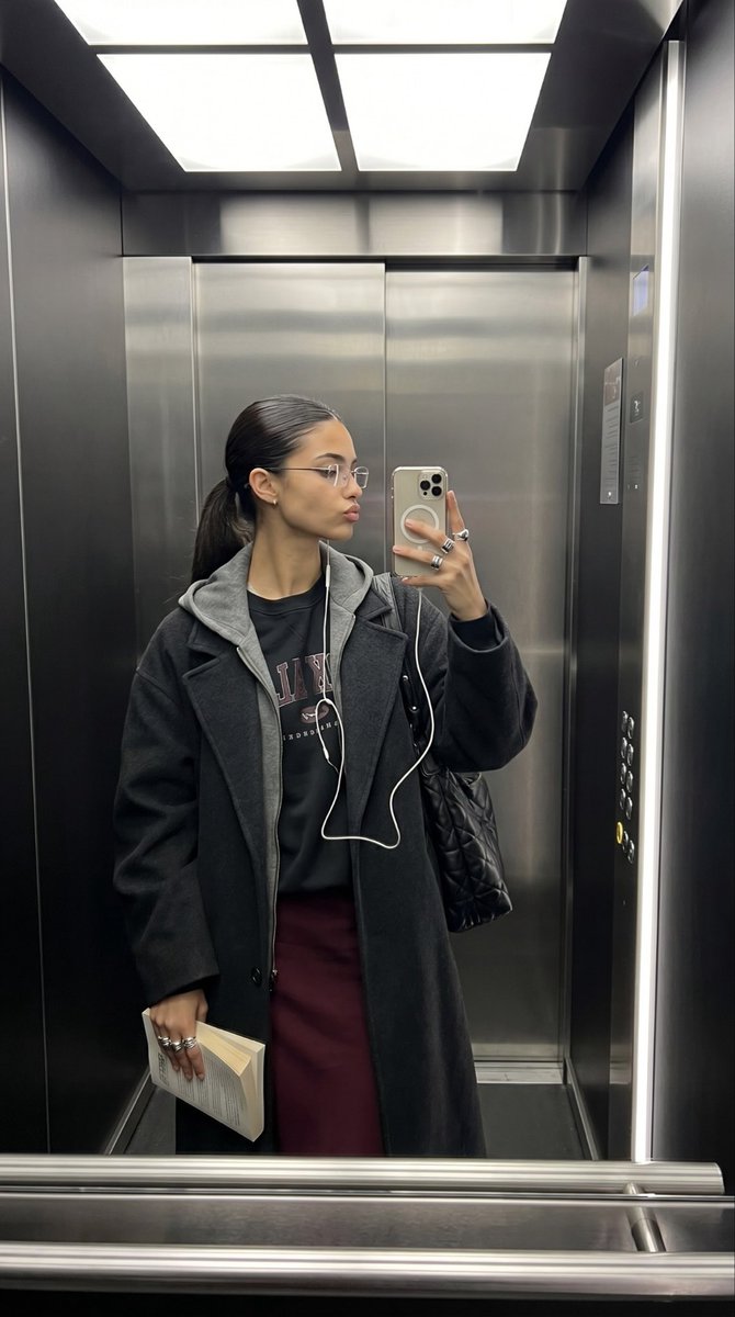 AI Prompt for Realistic Virtual Selfie in Elevator with Book Prop