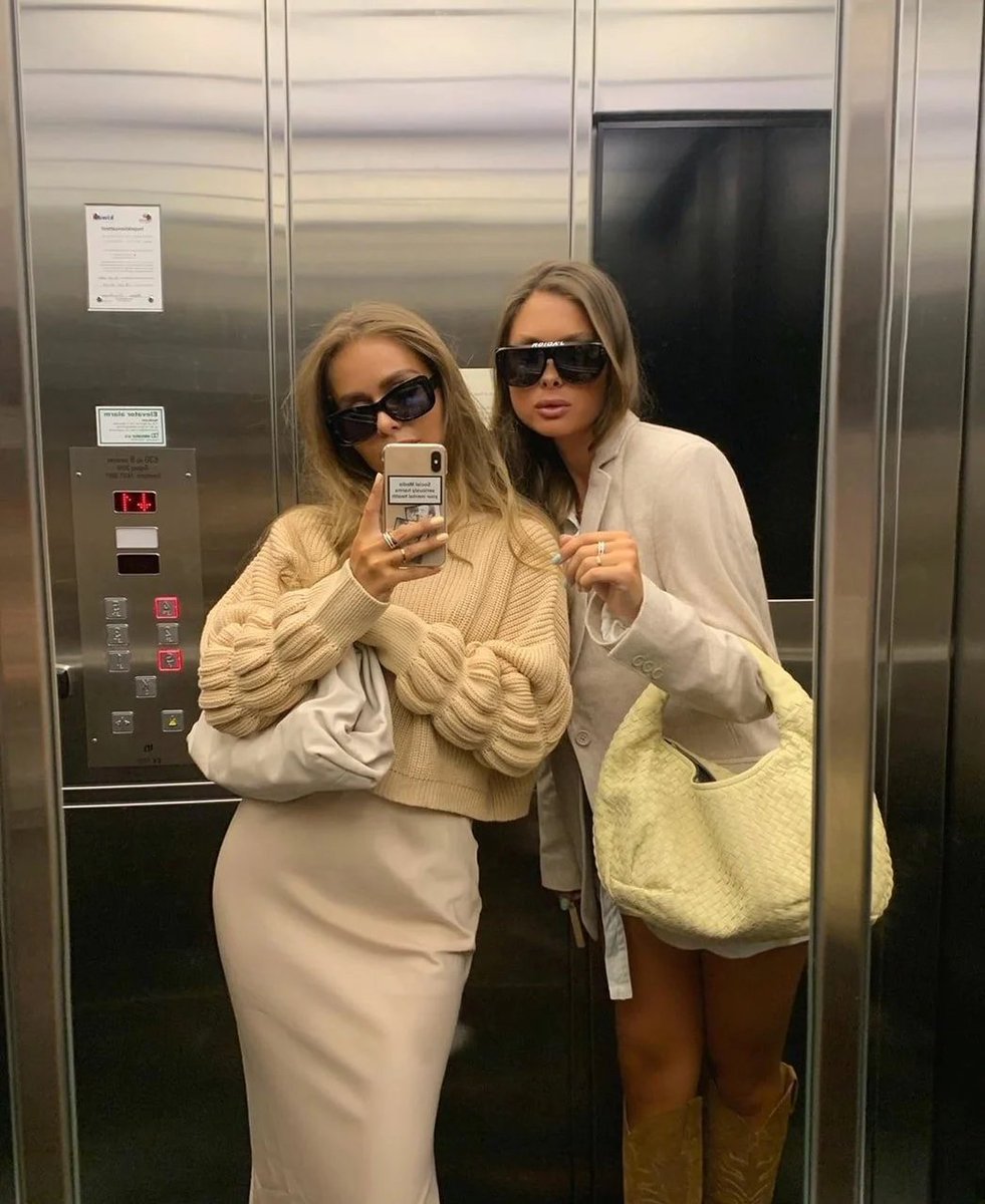 AI Prompt for Stylish Couple Mirror Selfie in Elevator