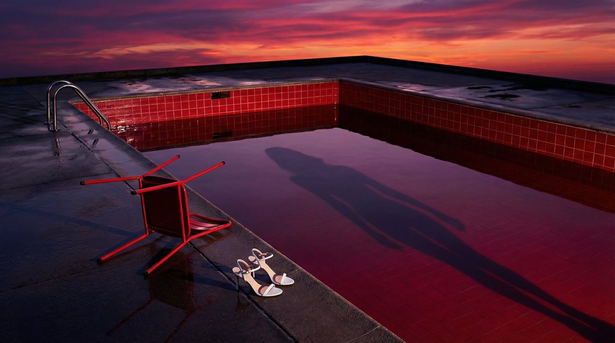 AI Prompt for Surreal and Elegant Swimming Pool Scene (Guy Bourdin Style)