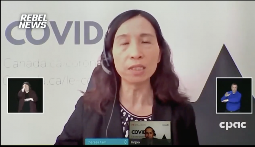 Tam finally admits Canadians were all lab rats as she reads from a script written for her by her masters.