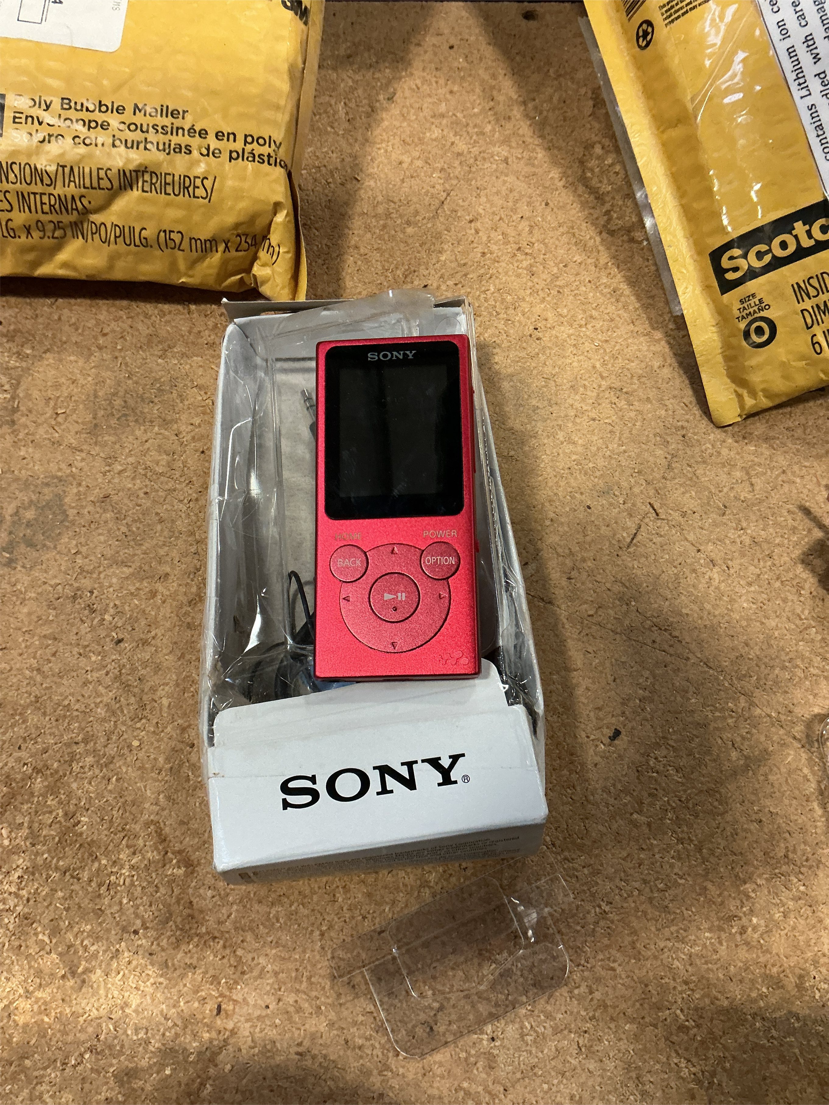 Sony Portable Red MP3 Player with AM/FM Radio, Clock, USB Port, and Earbuds - Works with iOS, Battery Included