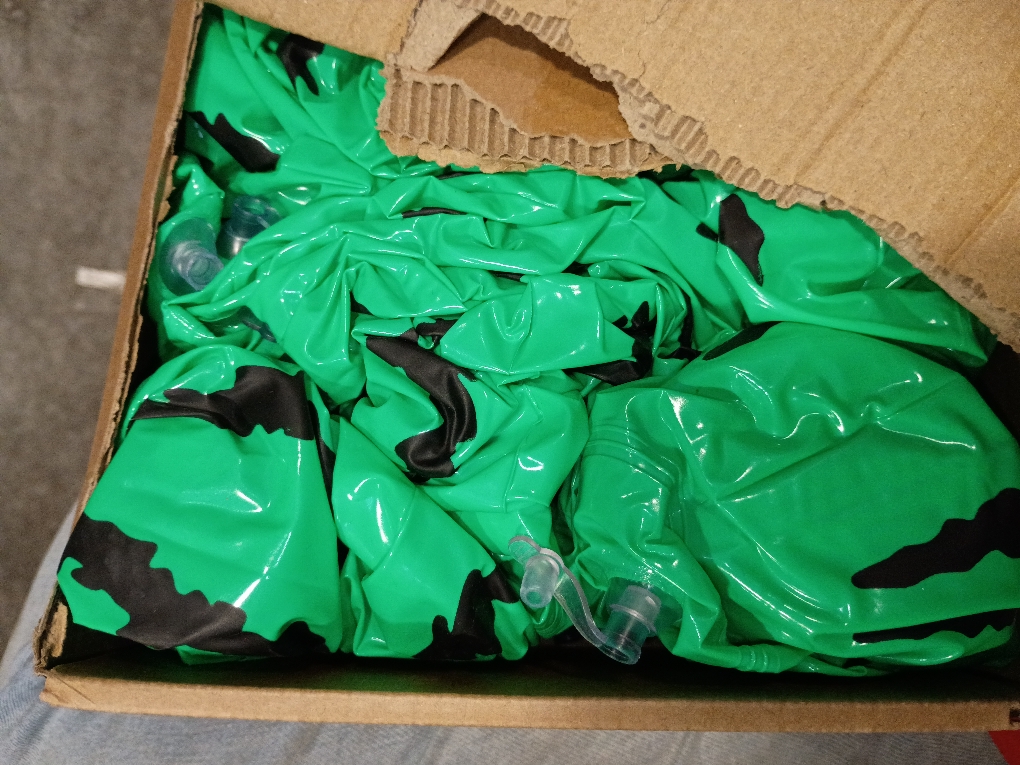 Green and black blow up toy