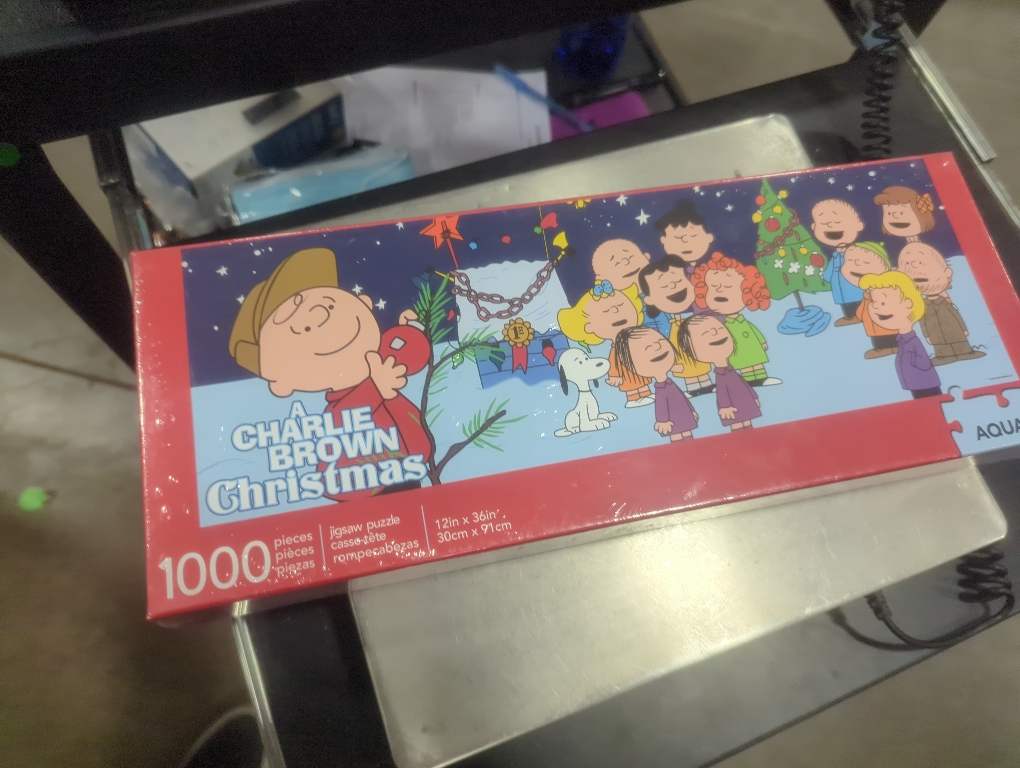 AQUARIUS Peanuts Charlie Brown Christmas Puzzle (Slim 1000 Piece Jigsaw Puzzle) - A Charlie Brown Christmas Puzzle - Officially Licensed - Glare Free - Precision Fit - 12 x 36 Inches, Multi Color