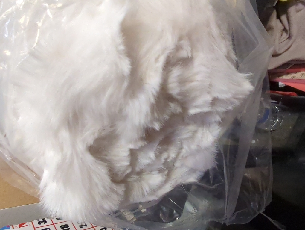 Soft white blanket for beds and sofas, perfect for snuggling.