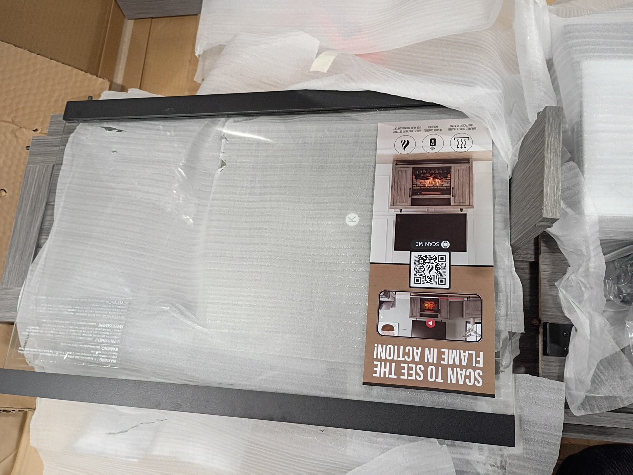 Style Selections 48-in W Iron Oak Infrared Quartz Electric Fireplace (littles damaged; see the pictures)