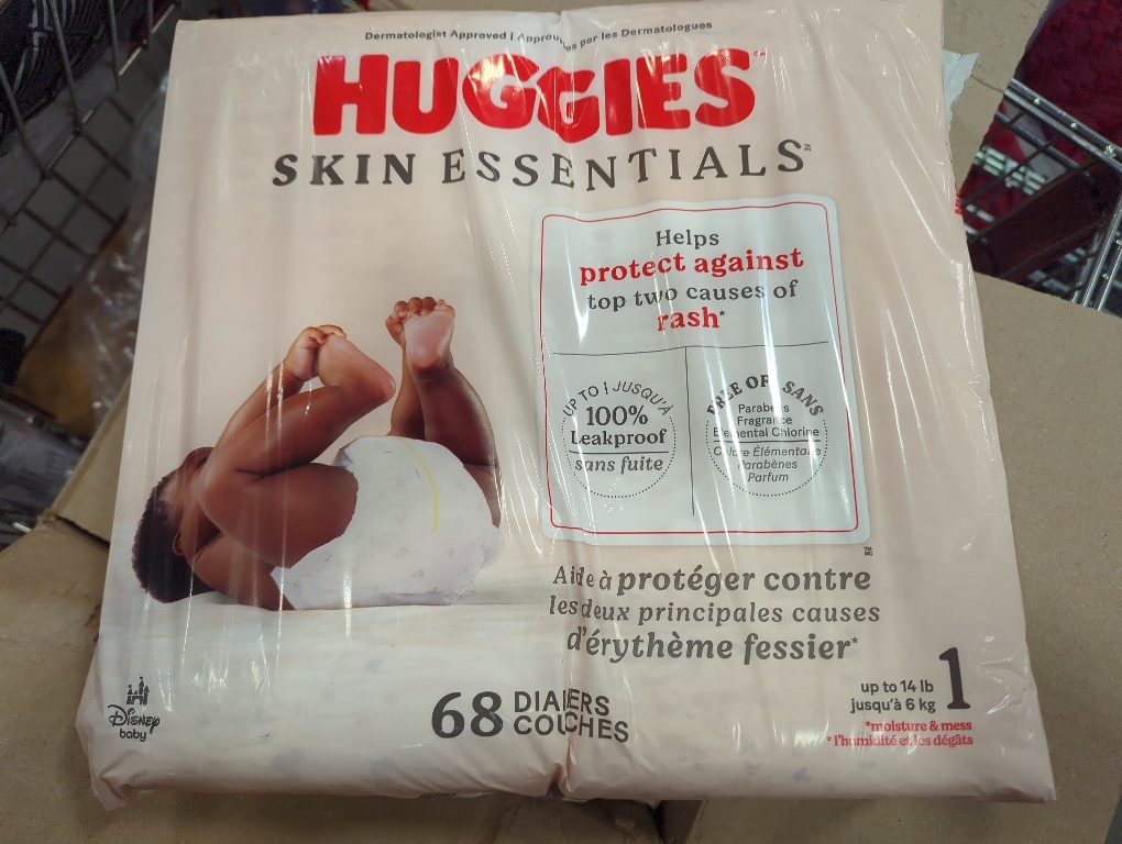Huggies Size 1 Diapers, Skin Essentials Baby Diapers, Size 1 (8-14 lbs), 84 Count, Packaging May Vary
