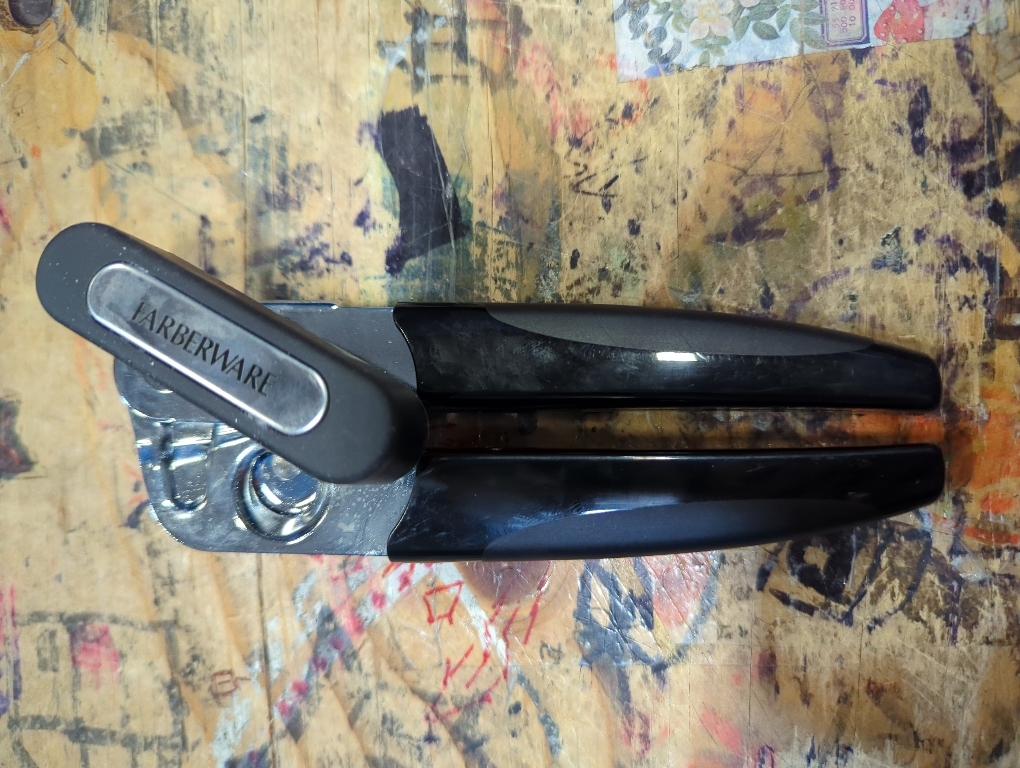 Professional Portable Can Opener With Black Handle, Made From Food-Safe