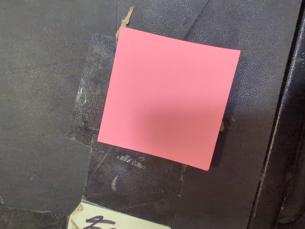 pink sticky note pad