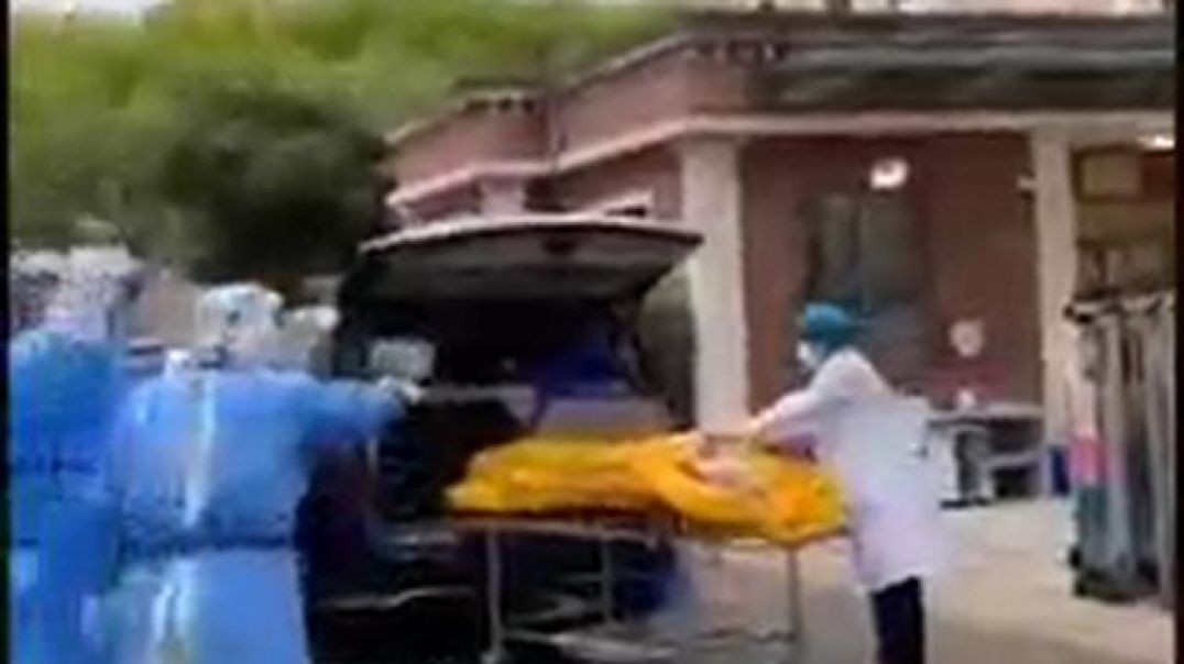 elderly Shanghai resident being taken to a morgue in a body bag — while still alive