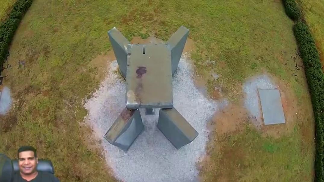 drone footage of blood stains on top of georgia guidestones from satanic rituals