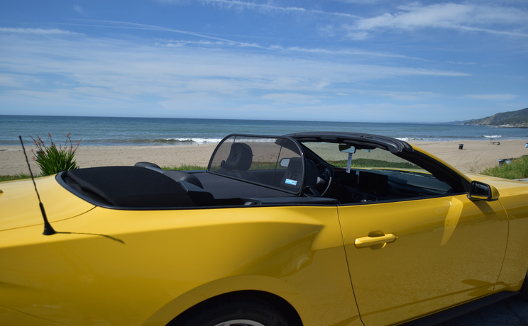 Mustang convertible wind deflector fits 2024 to 2030 at the beach designed and manufacturered by love the drive.