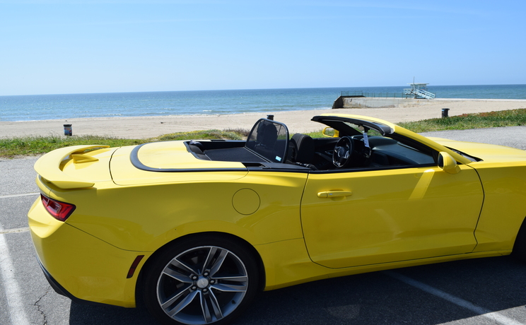 Camaro convertible wind deflector fits 2016 to 2024 at the beach in la closeup  3 manufacturered by love the drive.
