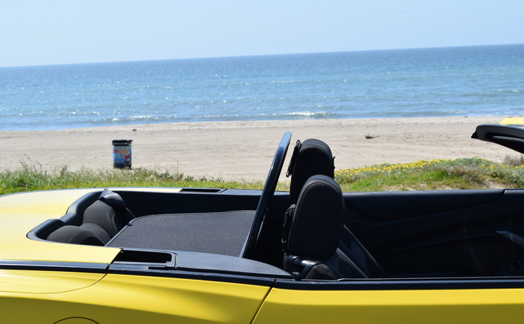 Camaro convertible wind deflector fits 2016 to 2024 at the beach in la closeup side view manufacturered by love the drive.
