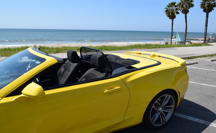 Camaro convertible wind deflector fits 2016 to 2024 at the beach in la drivers side view manufacturered by love the drive.